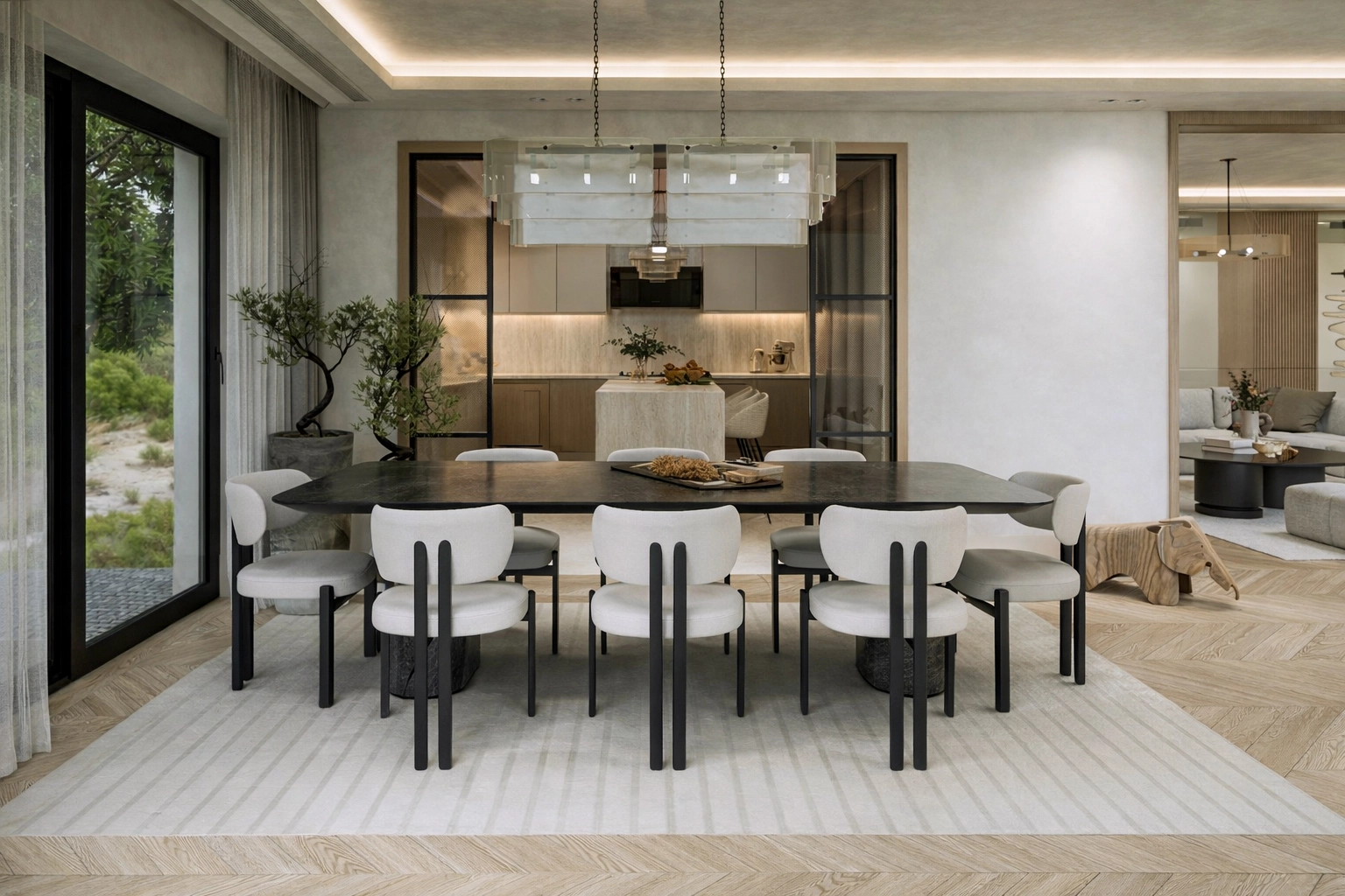 M.G. Villa yemek alanı — koyu mermer masa, bouclé sandalyeler ve kristal cam avize