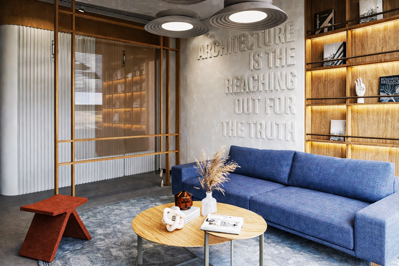 Metafor Ofis dinlenme alanı detay — terracotta keçe tabure, flüt cam bölme, pampas grass ve mimari yayınlar