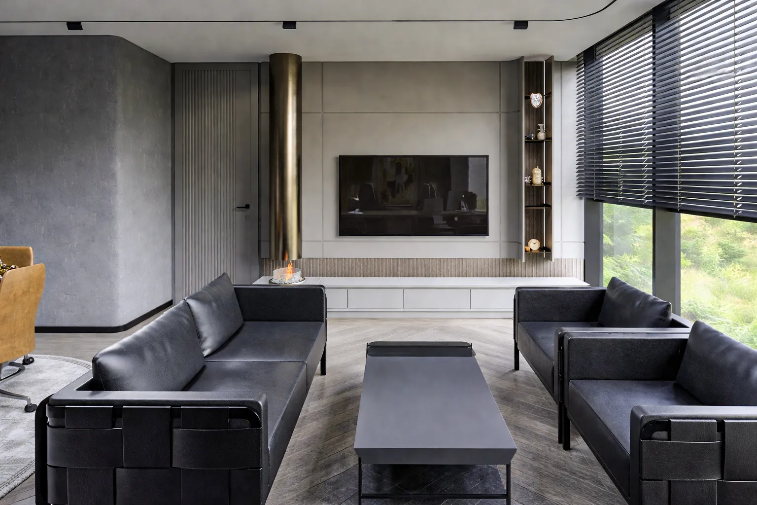 Metafor Yönetici Ofisi dinlenme alanı — siyah deri koltuklar, asma silindirik şömine, TV ünitesi ve ceviz raf sistemi